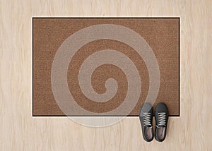 Blank brown door mat on the floor at home. Welcome mat with copy space for your text. Doormat mock up. Carpet at