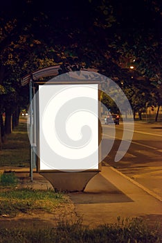 Blank Bus Station Billboard at Night