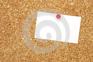 Blank business card on corkboard