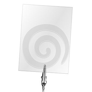 Blank business card on a metal memo holder clip. Card on wire silver clamp with place for you text over white background. Office