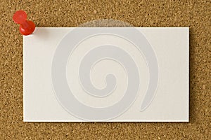 Blank Business Card Thumb Tacked To Corkboard