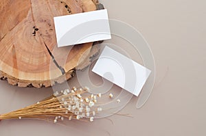Blank Business cards composition with wooden board and flowers, Top view, Flat lay, Copy space