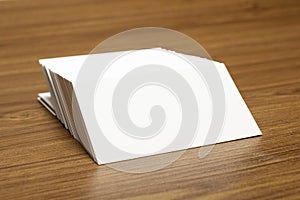 Blank business cards locked on stack on wooden textured background, 3.5 x 2 inches size as template for design presentation,