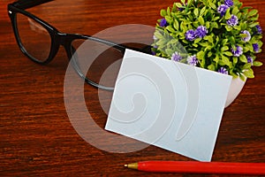 Blank business cards with pen and glasses