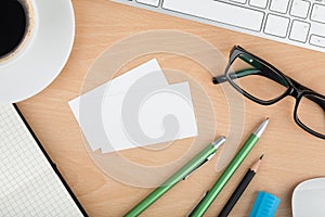 Blank business cards on wooden office table