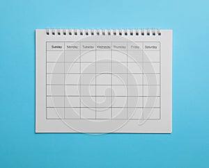 Blank calendar on light blue background