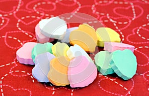 Blank candy hearts stacked.