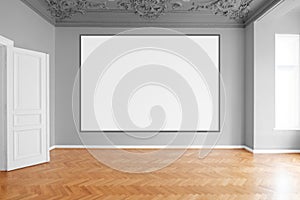 Blank canvas or picture frame hanging on white wall in empty room