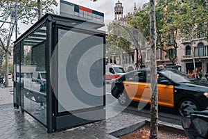 Blank Canvas White Outdoor Banner at Bus Stop In European City. Empty Outdoor Billboard.