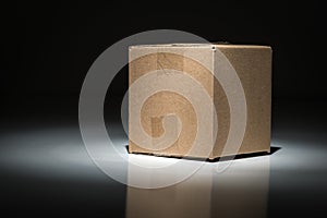 Blank Carboard Shipping Box Under Spot Light.