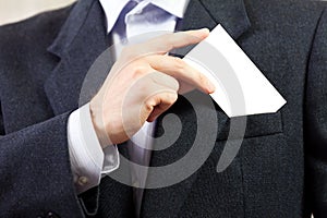 Blank card in businessmen hand