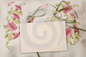 A blank card with wedding ring.