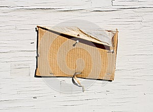Blank Cardboard Sign On Weathered Wood