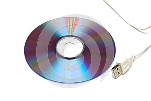 Blank CD-DVD disk and white USB cable