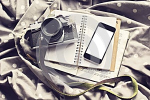 Blank cell phone screen with old style camera, diary and book, m