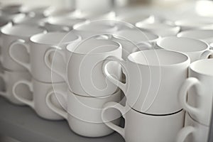 Blank ceramic cups, kiln in a studio, craft work