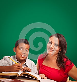 Blank Chalk Board Behind Hispanic Young Boy and Female Adult