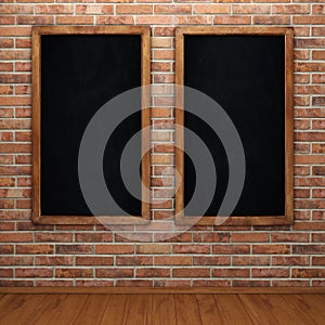 Blank chalkboard on brick wall