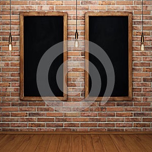 Blank chalkboard on brick wall with glowing light bulbs