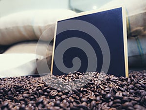 Blank Chalkboard Menu sign with Roasted Coffee beans background
