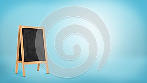 A blank chalkboard stand with a wooden frame on blue background.