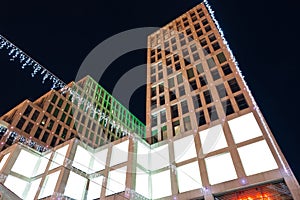 Blank citylight for advertising on the building at city night, copyspace for your text, image, design