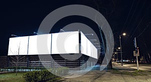 Blank citylight for advertising on the building at city night, copyspace for your text, image, design, flyer