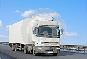 Blank clean truck on blue clouded sky background