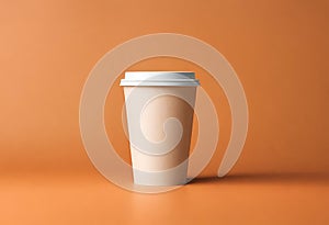 Blank coffee paper cup on the table. Mockup of coffee paper cup. Isolated on orange background, v16