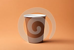 Blank coffee paper cup on the table. Mockup of coffee paper cup. Isolated on orange background, v18