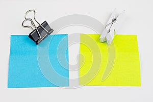 Blank colored sticky notes with clips. Office accessories for listing and memorizing on the table.