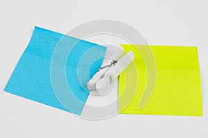 Blank colored sticky notes with clips. Office accessories for listing and memorizing on the table.