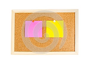 Blank colorful notes pinned on cork wood notice board isolate