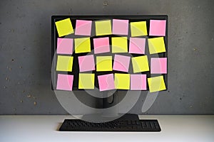 Blank colorful sticky notes reminders on computer monitor