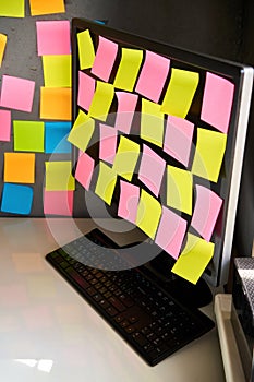 Blank colorful sticky notes reminders on computer monitor