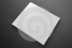 Blank compact disk cover on dark