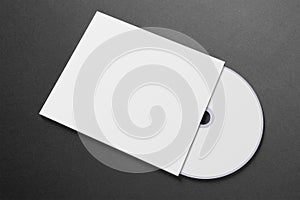 Blank compact disk cover on dark