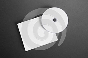 Blank compact disk cover on dark