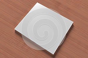 Blank compact disk cover on wooden background