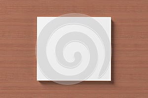 Blank compact disk cover on wooden background