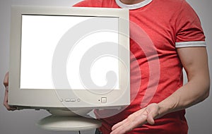 Blank computer monitor in hand.