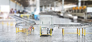 Blank conveyors on a blurred factory background