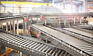 Blank conveyors on a blurred factory background photo