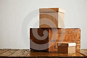 Blank corrugated cardboard boxes with vintage wooden box