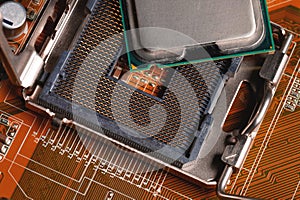 Blank cpu cpu socket with pins on motherboard in yellow color close-up