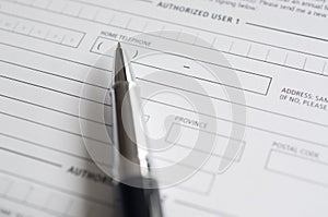 Blank credit application form and pen