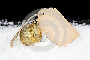 Blank decorative cardboard tag and golden glittering ornament si