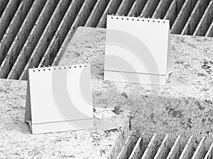 Blank desk top calendar, blank desktop flip-top calendar on cracked painted cement concrete stone form, mockup template for corpor