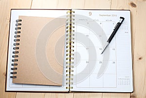 Blank desktop calendar with text book
