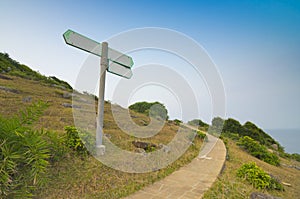 Blank Direction Sign With Stone Road